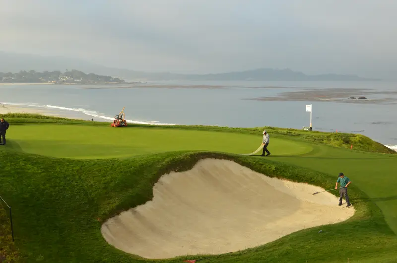 When there are clouds between the sun and turf, but shadows are still visible, PPFD is at about 75% of potential. partially cloudy and raking bunkers at Pebble Beach Golf Links